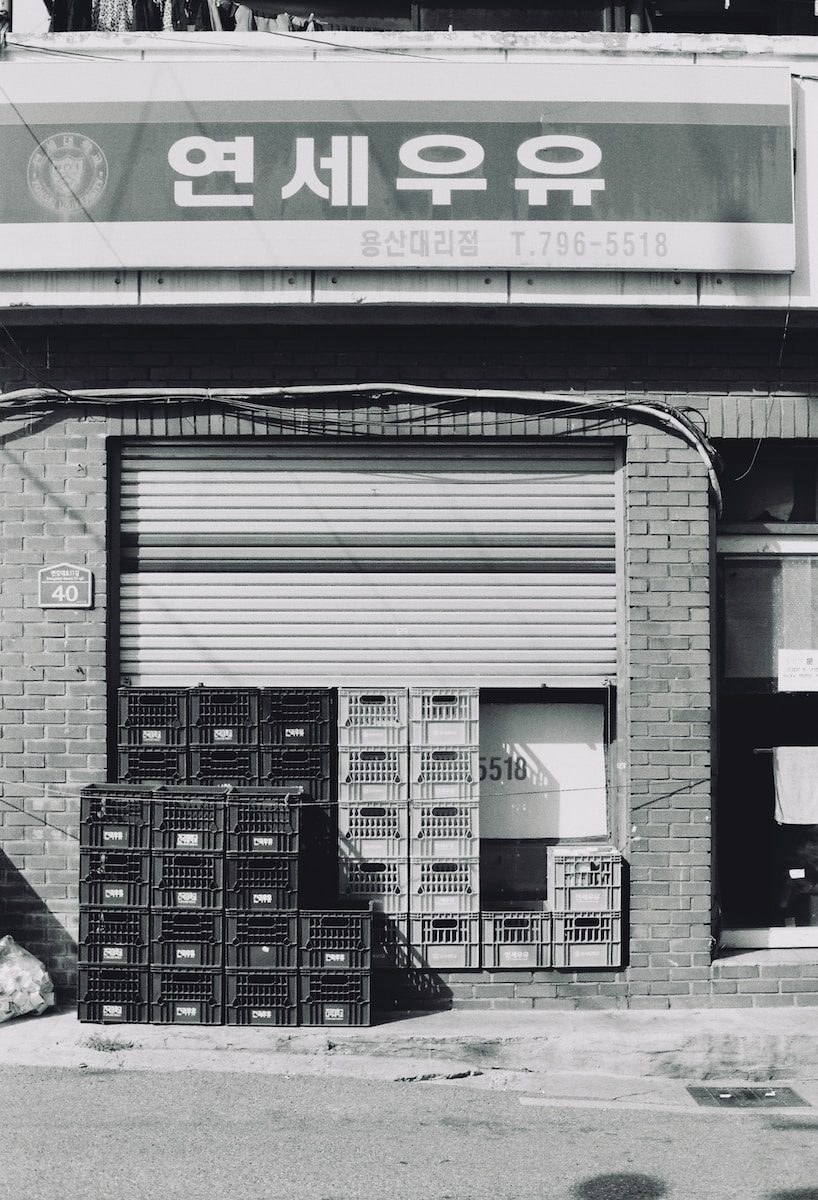 a black and white photo of a store front